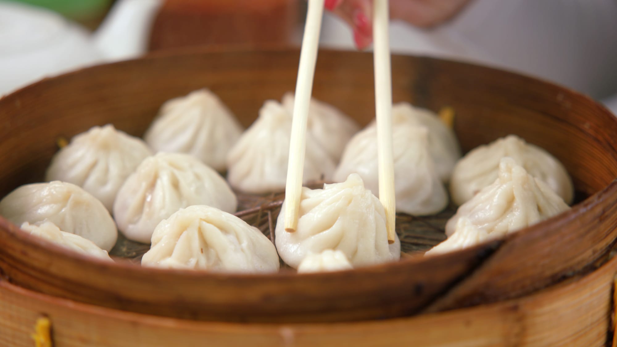 Xiaolongbao being picked up Shanghai