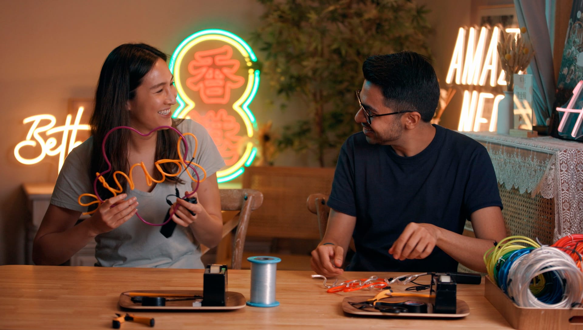 Jamie Ha and Arjun Chawla making neon at neon workshop at Amazing Neon in Hong Kong
